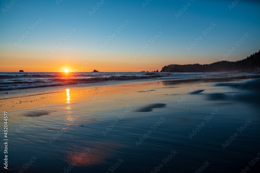 Sunset over the beach with reflections on the Washington coast