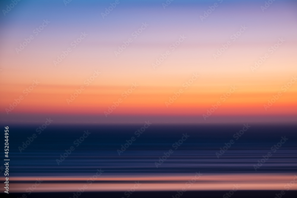 Obraz premium Haystack rocks silhouette against colorful sunset evenings on the beach