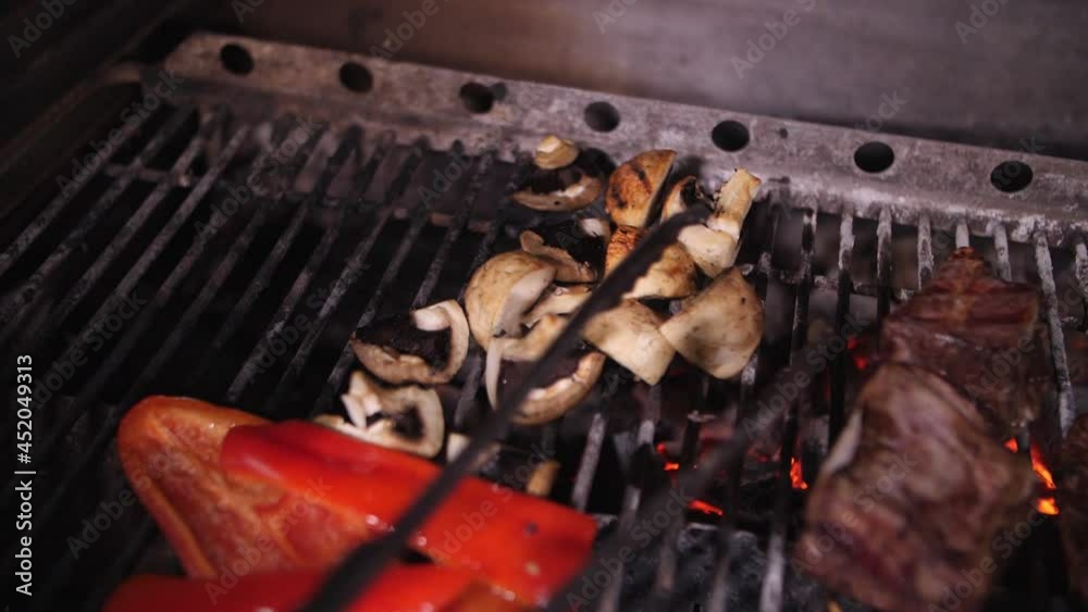meat and vegetables are cooked on a grill meat and vegetables are cooked on a grill
