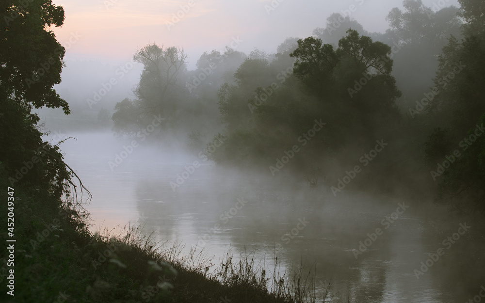 Photo of the misty river made at the sunrise Photo of the misty river made at the sunrise