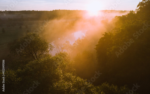 Mist covering the river in the morning shot from the drone © d1tus