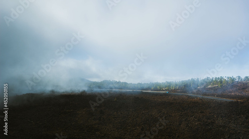 A mountain road covered with clouds