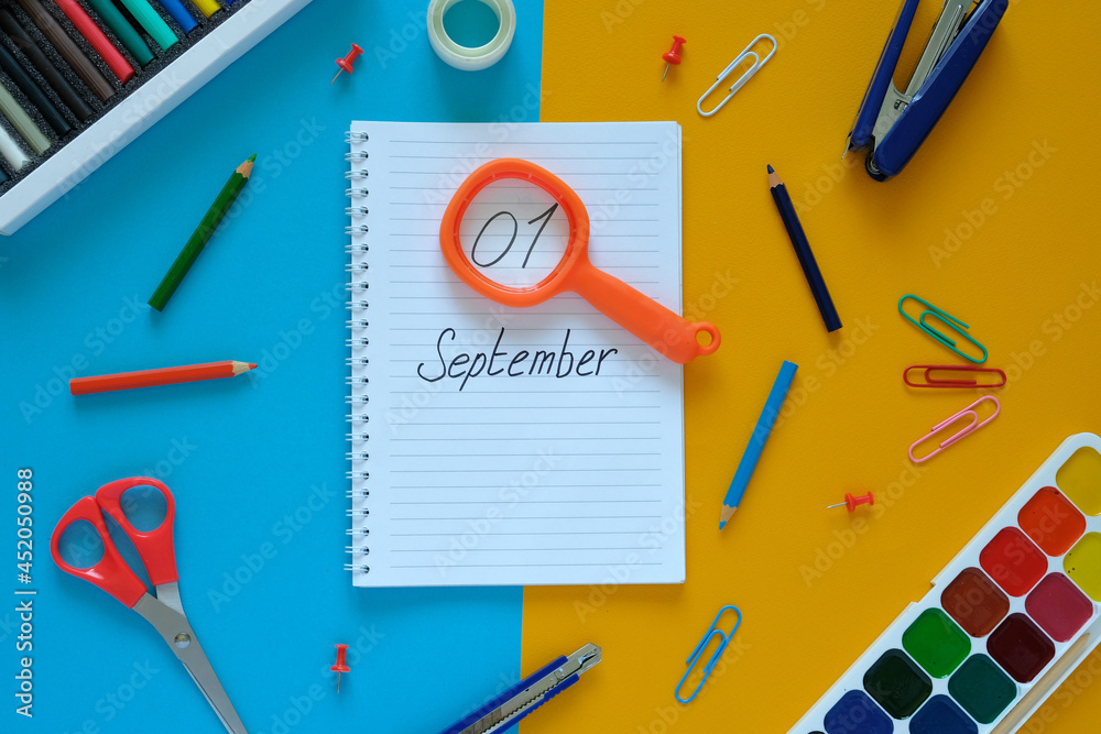 Flat lay. Yellow-blue background. In the center is a notebook with the words Flat lay. Yellow-blue background. In the center is a notebook with the words