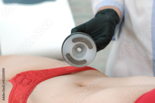 vacuum hardware massage of the abdomen of a young woman