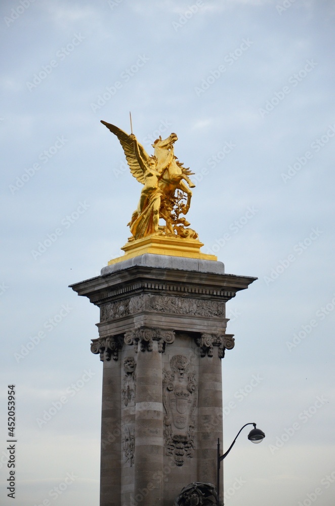 Fototapeta premium The famous Alexandre III Bridge at sunset in Paris, France