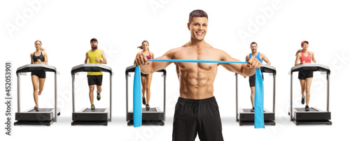 Shitless man exercising with a rubber band and people on treadmills photo