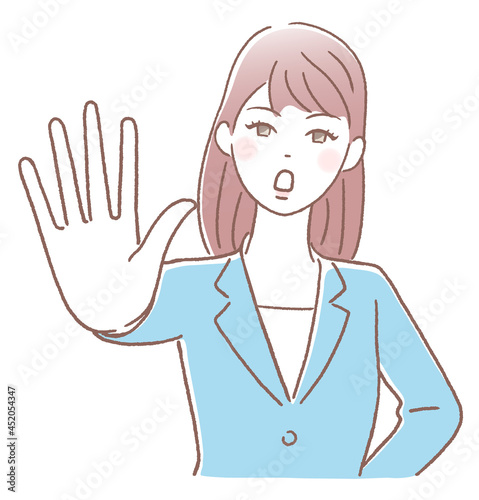 手の平を前に出して拒否する若い女性
