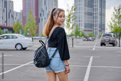 Single portrait of beautiful smiling fashionable teenage girl © Valerii Honcharuk