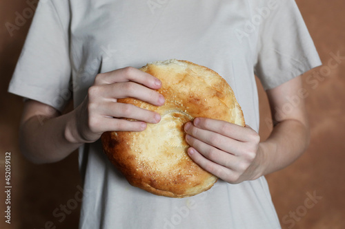 person holding a flatbread