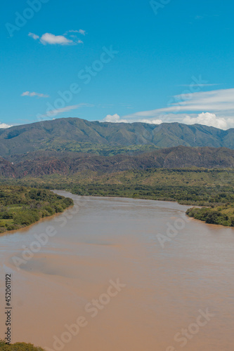 river in the mountains with blue sky