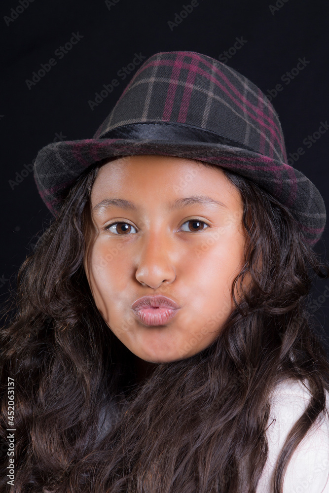 portrait of beautiful latin teenager with hat throw a kiss
portrait of beautiful latin teenager with hat throw a kiss