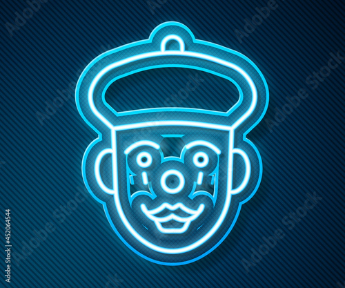 Glowing neon line French mime icon isolated on blue background. Vector