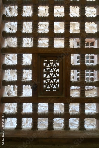 Carved wooden lattice in the window of the fortress.