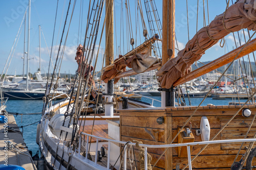 Moored nautical vessels at sea port San Antonio de Portmany, Balearic Islands, Ibiza, Spain. Sunny spring day.