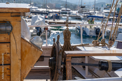 Moored nautical vessels at sea port San Antonio de Portmany, Balearic Islands, Ibiza, Spain. Sunny spring day.