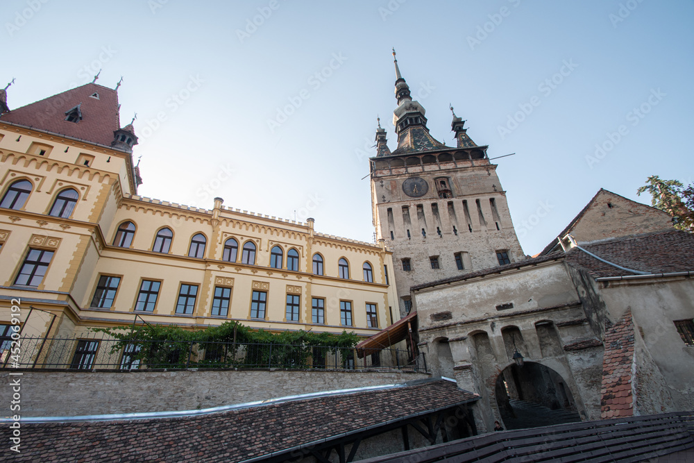 View of famous medieval fortified city and the Clock Tower, Sighisoara, Romania.