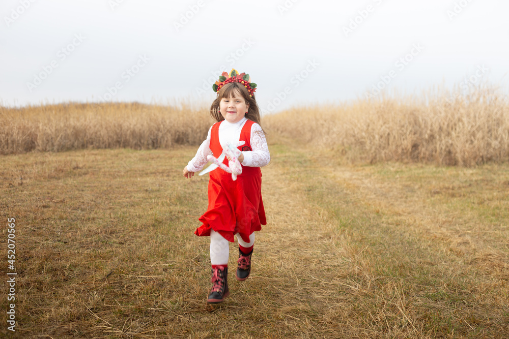 girl run in a rowan wreath in November girl run in a rowan wreath in November