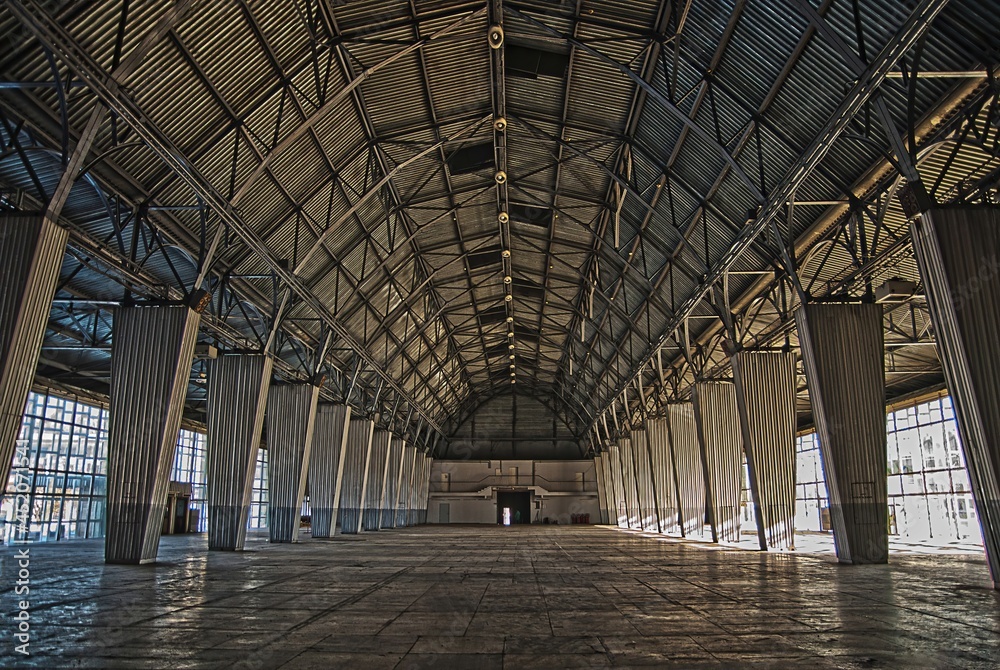 empty big hangar created with steel and glass