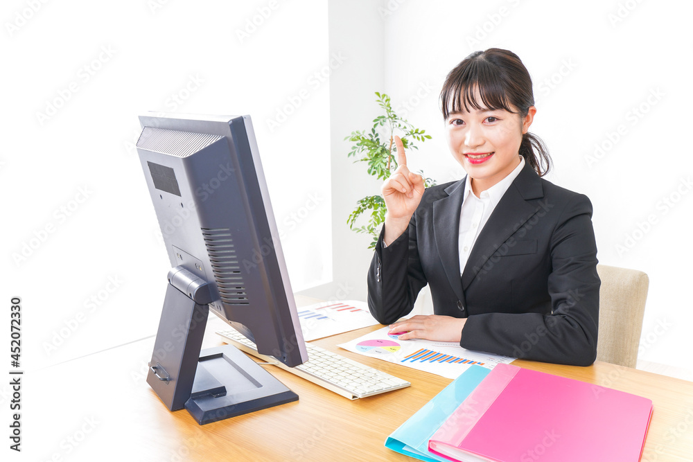 Young business woman pointing something with smile Young business woman pointing something with smile