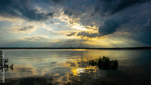 sunset over the lake © Jdevon