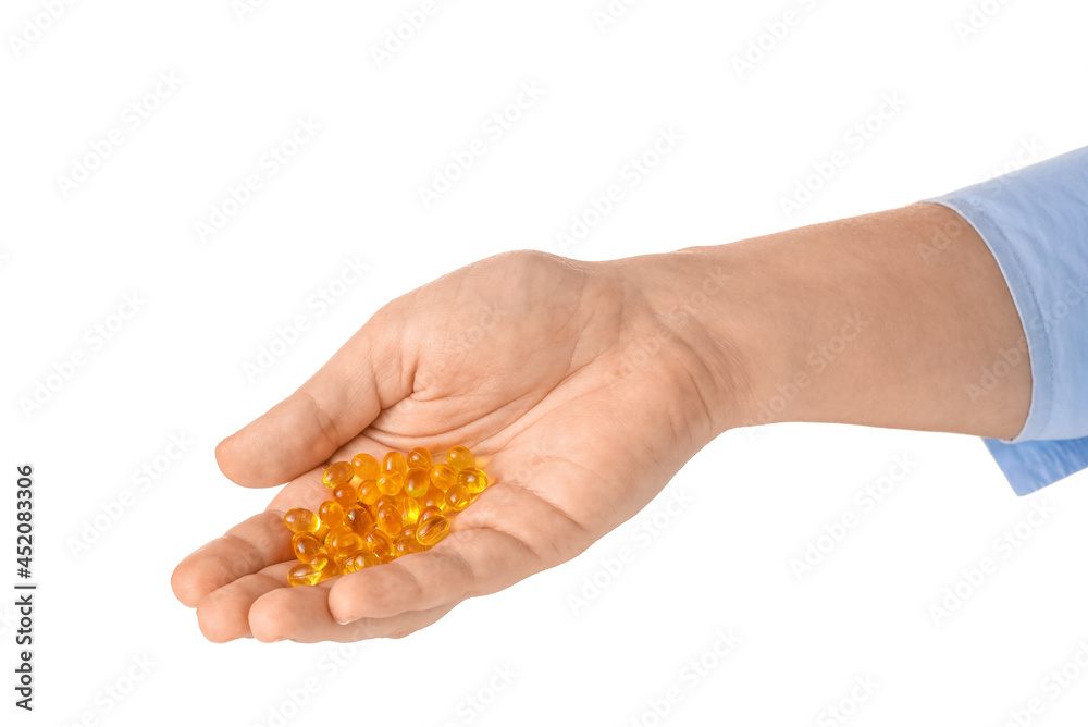 Female hand and pills on white background Female hand and pills on white background