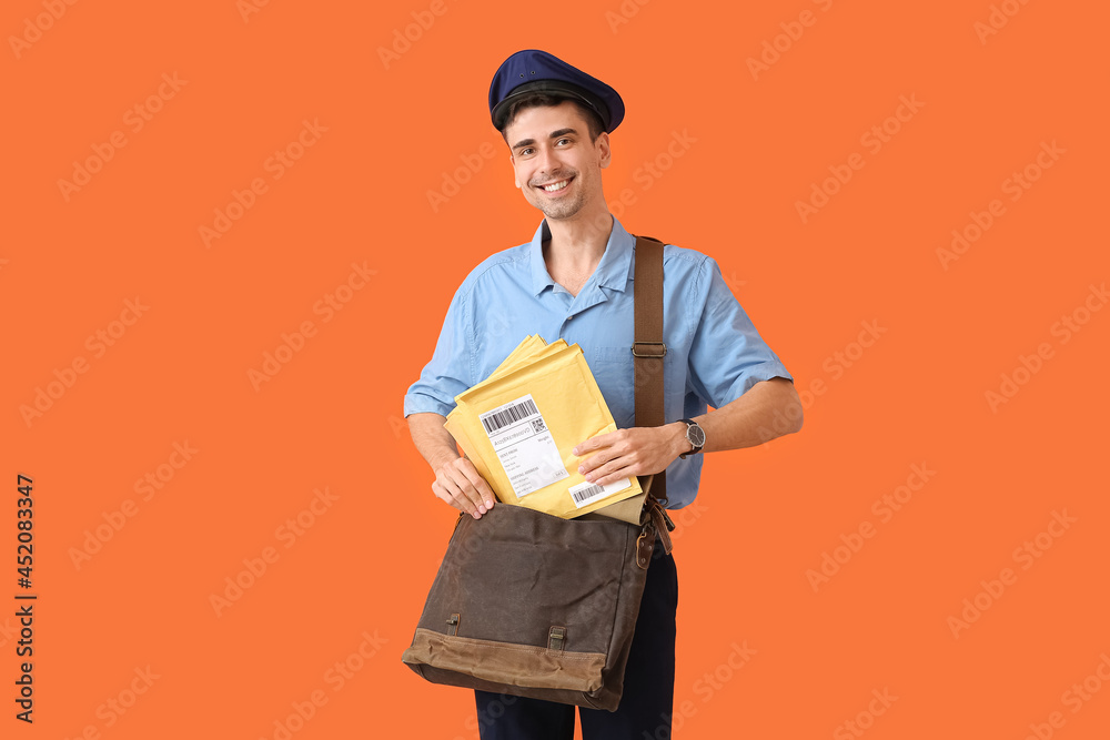 Handsome young postman on color background Handsome young postman on color background