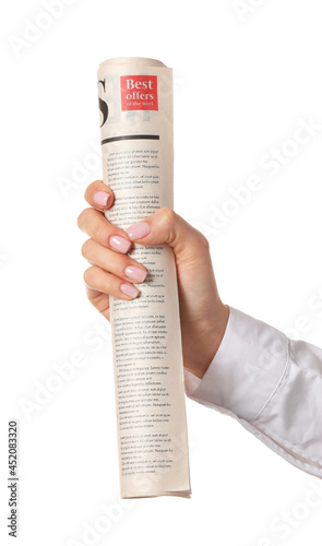 Female hand and newspaper o...