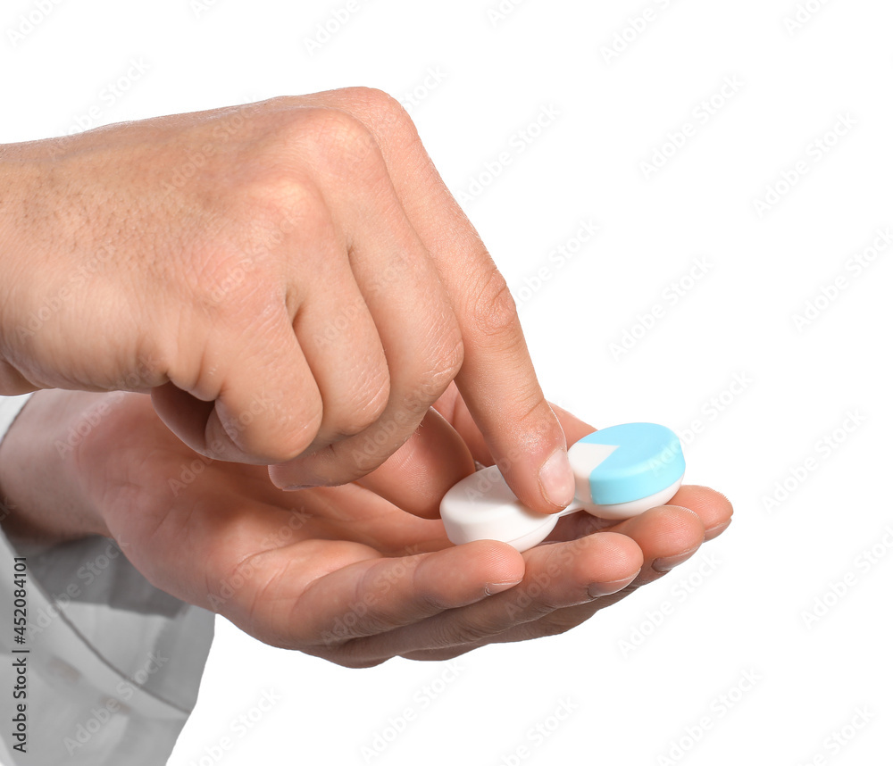 Male hands with contact lenses on white background Male hands with contact lenses on white background