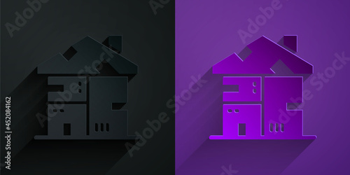 Paper cut Homeless cardboard house icon isolated on black on purple background. Paper art style. Vector