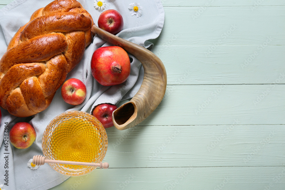 Honey with fruits, shofar and challah on wooden background. Rosh hashanah (Jewish New Year) celebration Honey with fruits, shofar and challah on wooden background. Rosh hashanah (Jewish New Year) celebration