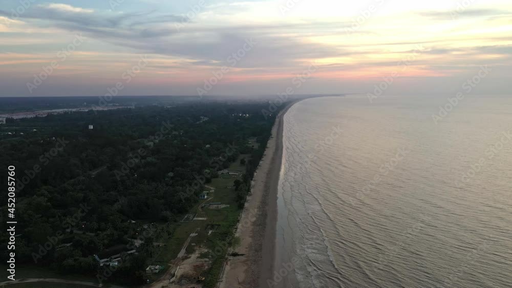 Aerial Views of Coastline, waves and beach at sunset time, Borneo island