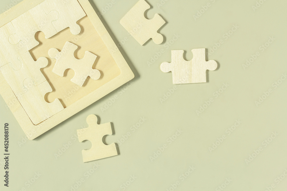 A flat lay image isolated assembled jigsaw puzzle concept idea best the choice key copy space on gray background. A flat lay image isolated assembled jigsaw puzzle concept idea best the choice key copy space on gray background.