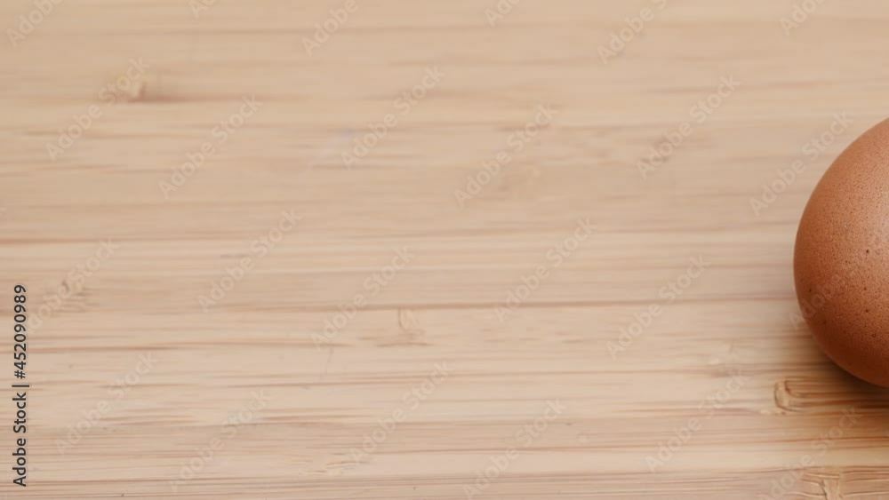 Slide shot of video 4k and full HD of quality healthy organic egg with eggshell isolated on clean background.