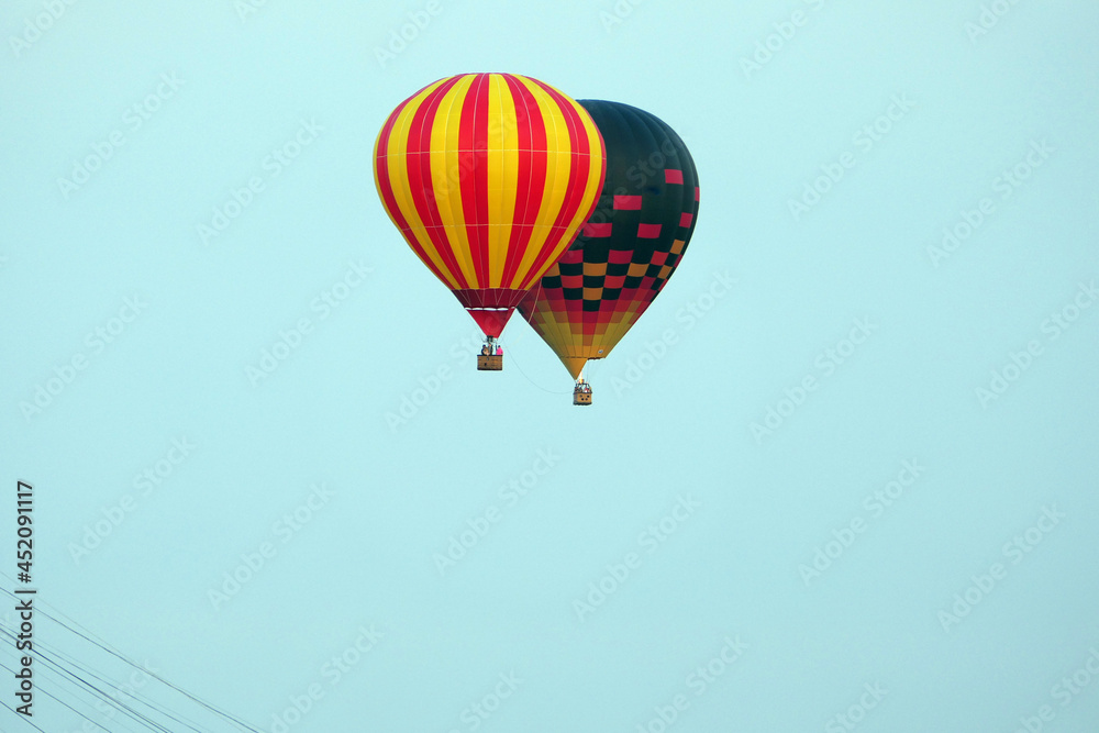 Fototapeta premium Aerostat in the sky over the city, Nizhny Novgorod 800. Aerostat and aeronautics. High quality photo