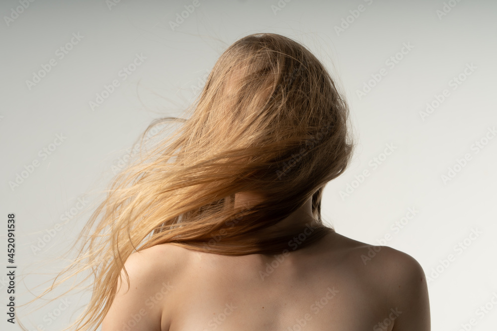 portrait of a woman with loose hair in the studio portrait of a woman with loose hair in the studio