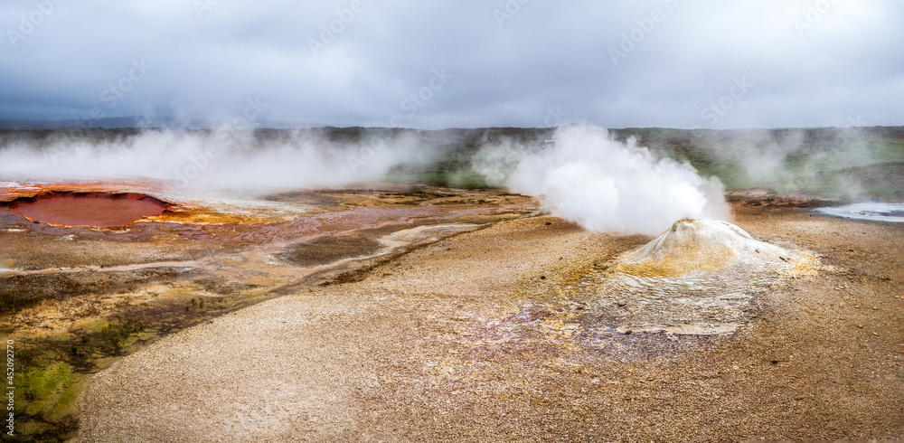 Steam and geysers in the geothermal volcanic desert zone Hveravellir. Iceland
