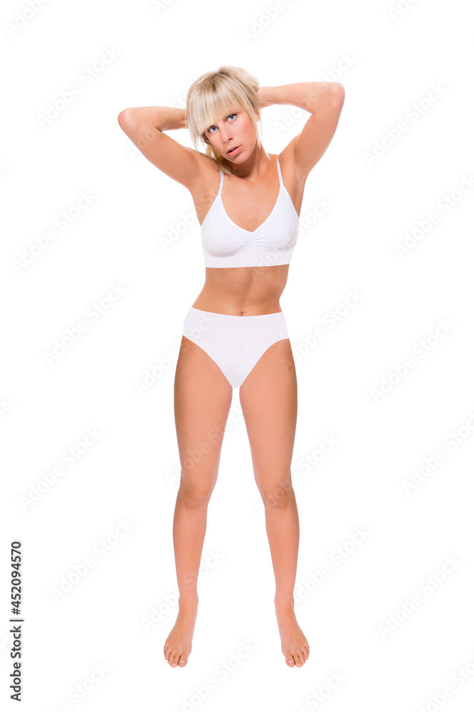 Full length portrait of a beautiful blonde woman wearing a white bikini, studio photo isolated in front of white background Full length portrait of a beautiful blonde woman wearing a white bikini, studio photo isolated in front of white background