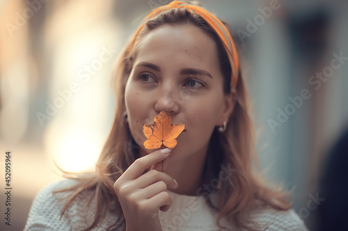 happy woman in autumn look, young girl outside in autumn mood