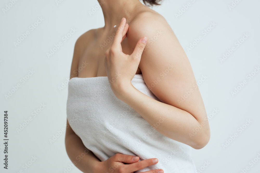 woman with bare shoulders in towel clean skin cropped view