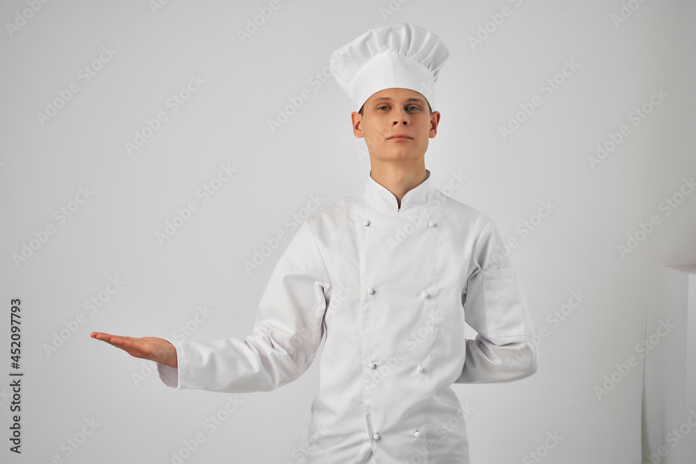 a man in a chef's uniform gesturing with his hand work professional cooking a man in a chef's uniform gesturing with his hand work professional cooking