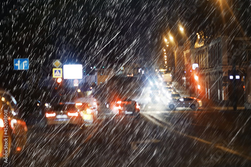 blurred background autumn auto rain on the road   night lights and raindrops in the autumn traffic jam on the road  urban style traffic