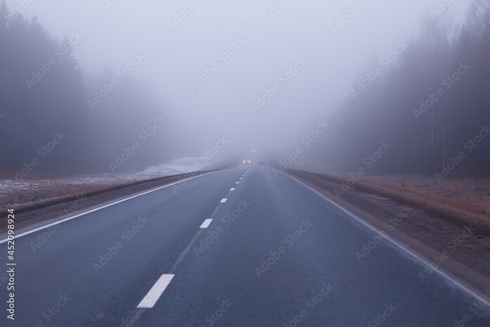 abstract winter road fog snow, landscape view in november transport