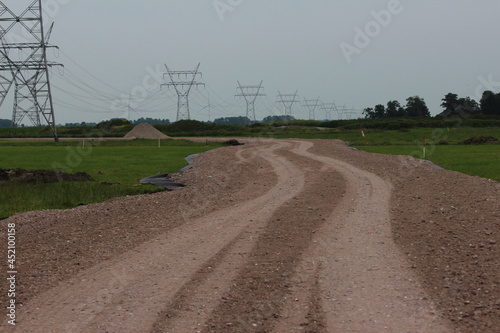 Broken powerlines and steel damage towers after downburst storm in Kerkdorp Oosterwolde photo