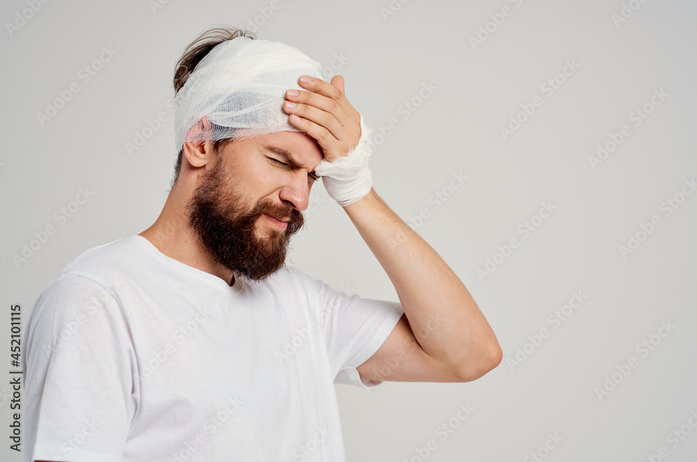 bearded man head and arm injuries health problems light background bearded man head and arm injuries health problems light background