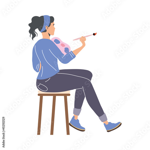 female artist seated painting