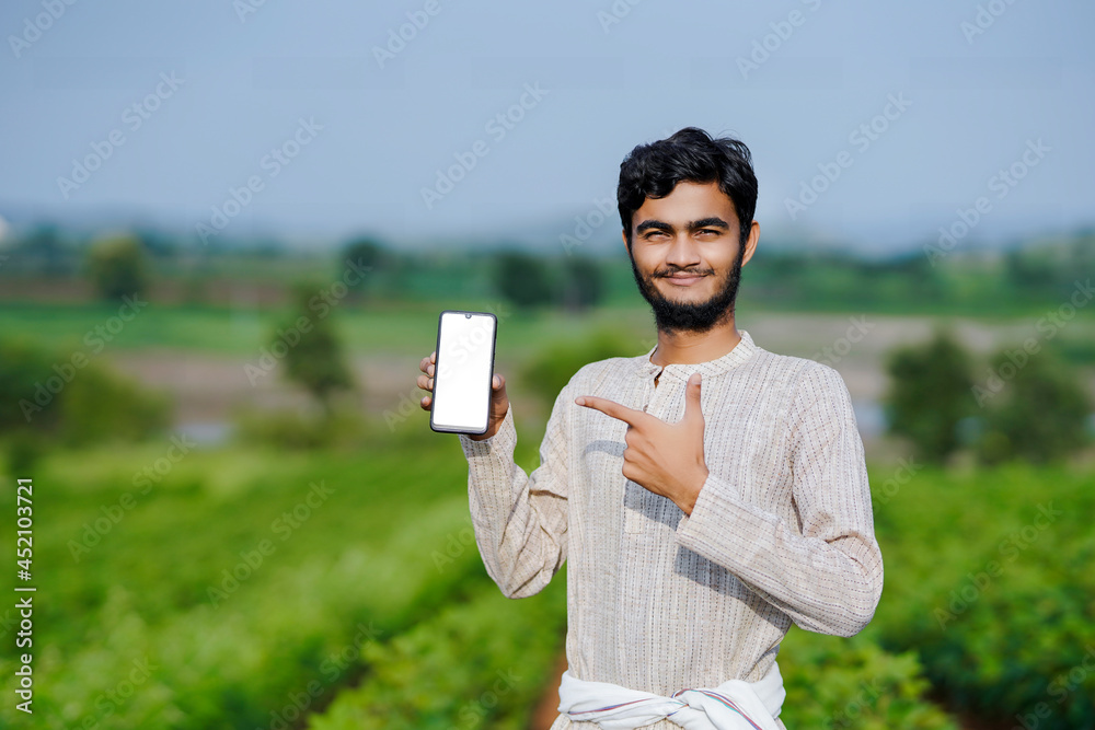 Indian farmer Showing a mobile screen at green cotton crop Stock Photo ...