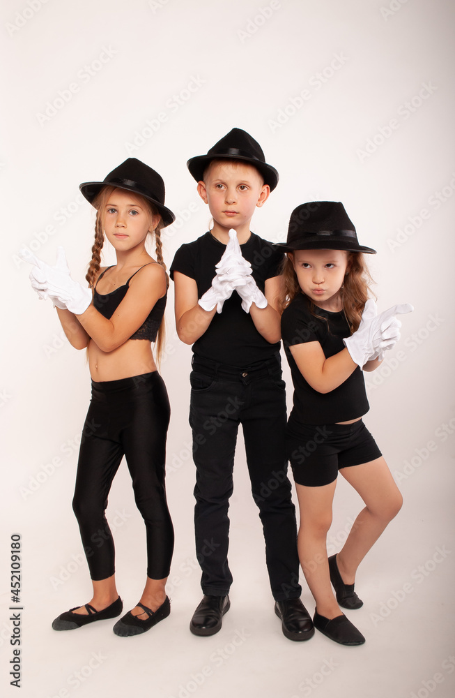 boys and teenage girl in the image of a mime with a white mask on her face isolated on a white background in white theater gloves, theater children actors, actress. boys and teenage girl in the image of a mime with a white mask on her face isolated on a white background in white theater gloves, theater children actors, actress.