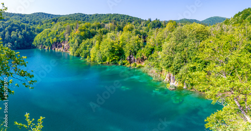 View of waterfall at Plitvice lakes, Croatia. Panoramic view of fresh nature, blue water and green trees. © Martin