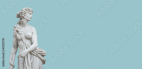 Banner with an old statue of sensual Italian or Greek Renaissance Era woman in historical downtown city park in Potsdam, Germany. Concept of historical architecture heritage.