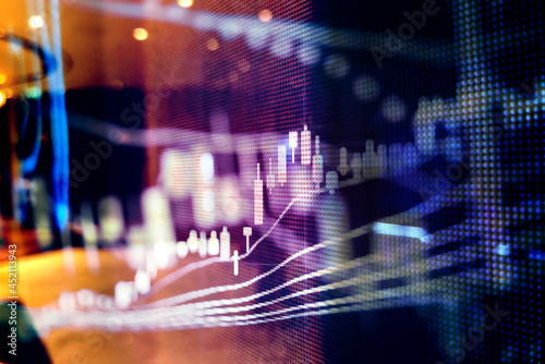 Abstract financial trading graphs and digital number of foreign exchange market trading on monitor. Background of gold and blue digital chart to represent stock market trend.	
